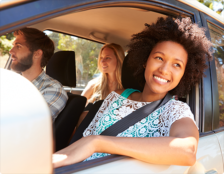 A Getaround utility guest driving down the road in a Getaround shared car.